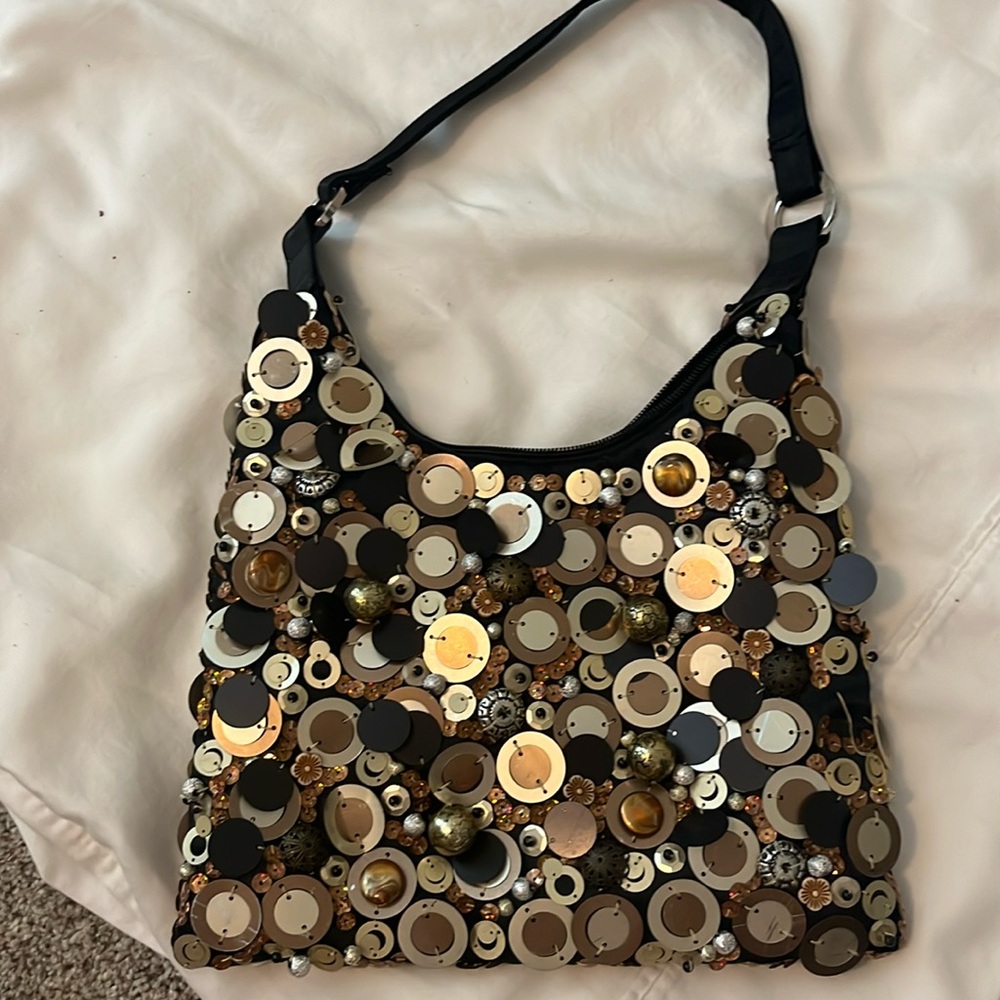 Fun party purse with gold, silver and bronze accents